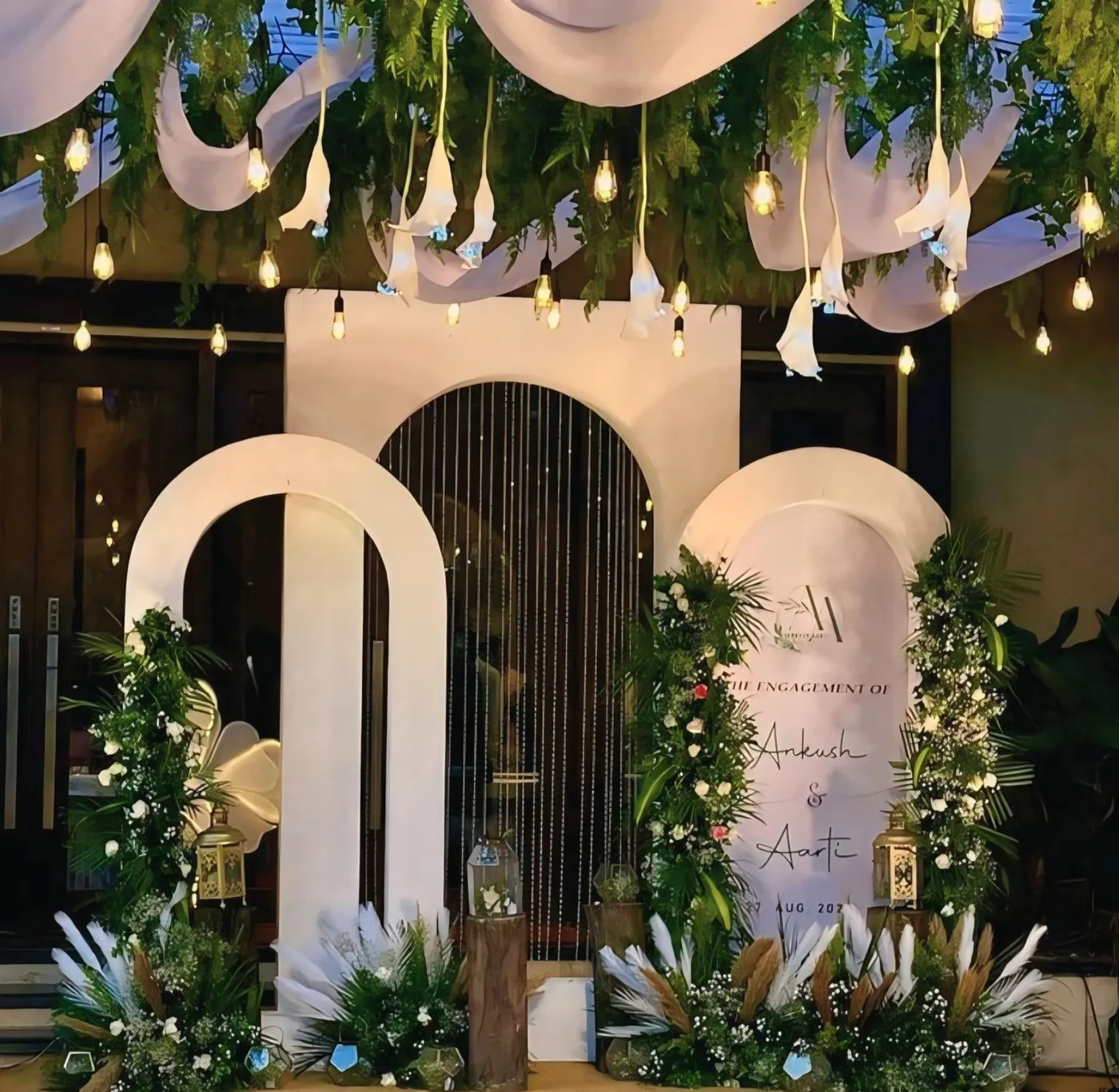 Sculptural arches, flowers and a personalised engagement stage